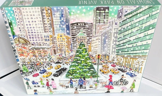 Snowfall On Park Avenue 1000 piece jigsaw puzzle by Galison. Jigsaw puzzle box with a cityscape design featuring a Christmas tree and people.