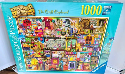 Ravensburger puzzle box titled 'The Craft Cupboard' with 1000 pieces on a white background