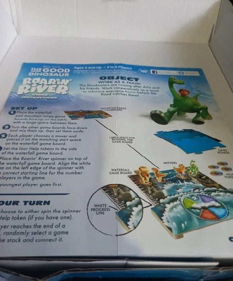 Board game instructions for 'Roarin' River' with a dinosaur illustration on a white background