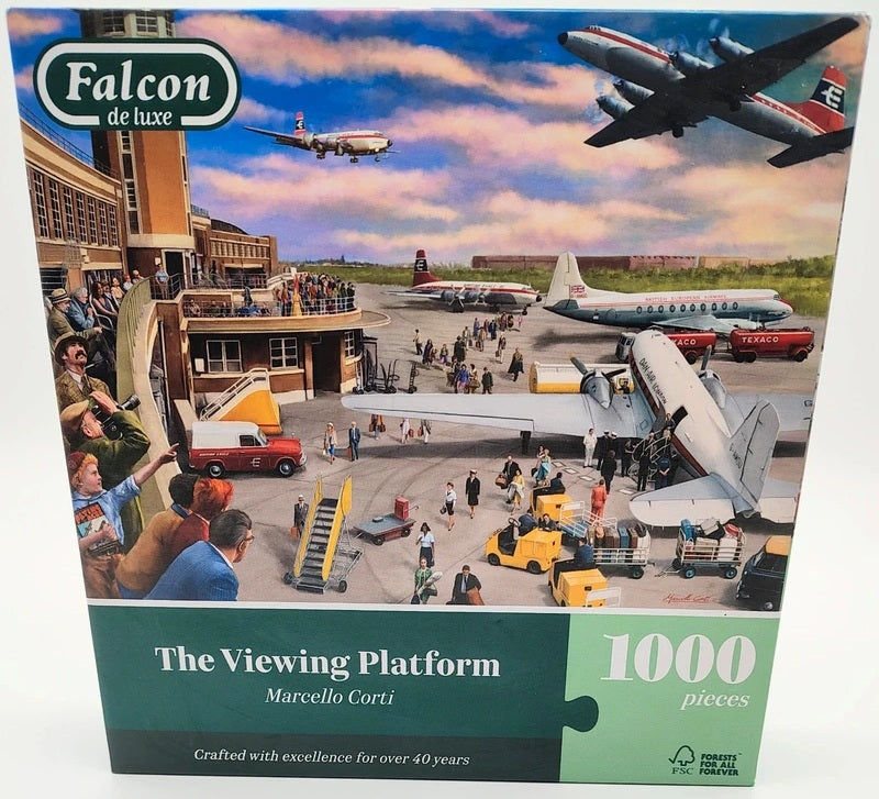 Falcon de luxe 'The Viewing Platform' 1000-piece jigsaw puzzle box by Marcello Corti, featuring a colorful illustration of an airport scene with airplanes, tarmac activity, and passengers.