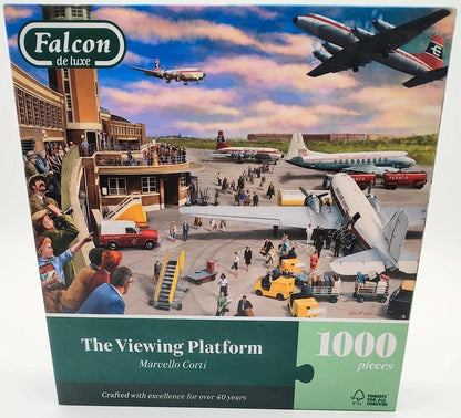 Falcon de luxe 'The Viewing Platform' 1000-piece jigsaw puzzle box by Marcello Corti, featuring a colorful illustration of an airport scene with airplanes, tarmac activity, and passengers.