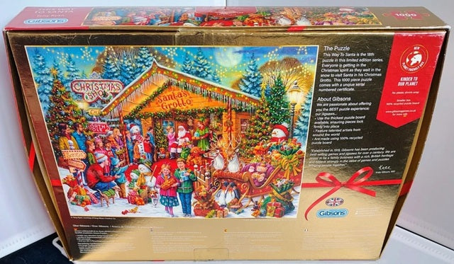 Jigsaw puzzle box featuring a Christmas scene with Santa's Grotto and colorful decorations.