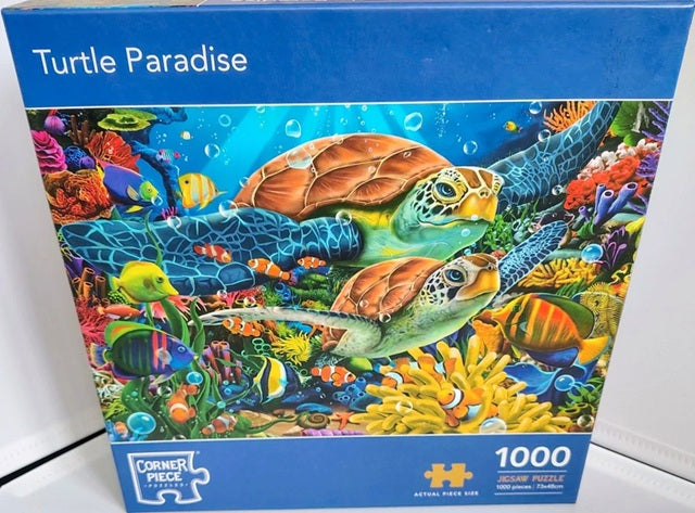 Jigsaw puzzle box titled 'Turtle Paradise' with colorful turtle illustration on a blue background.
