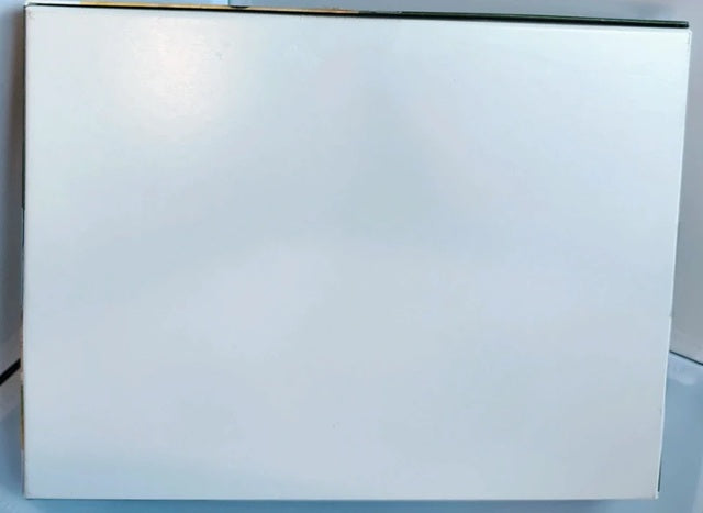 White rectangular object on a reflective surface