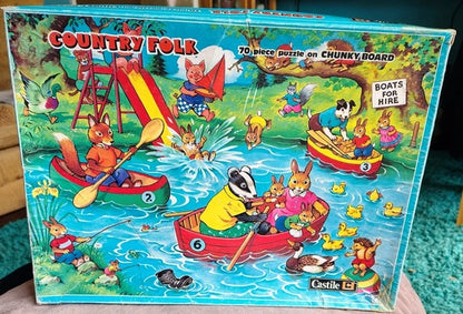 Vintage Cestile 'Country Folk' puzzle box with cartoon animals in boats on a lake.
