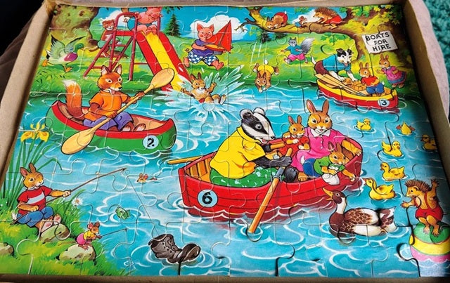 Children's puzzle with animal characters on a lake
