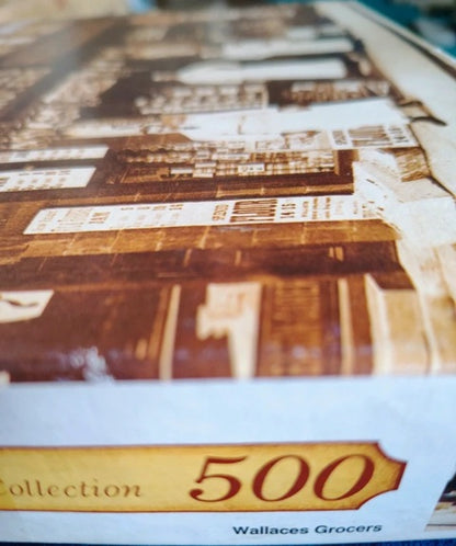 Close-up of a product packaging with 'Wallaces Grocers' branding and 'Collection 500' text.