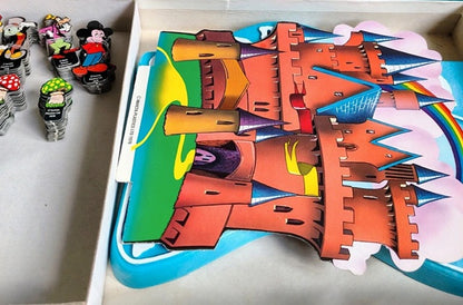 Colorful castle-shaped building blocks on a white surface