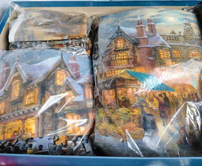 Packaged puzzle with a winter village scene in clear plastic wrap.