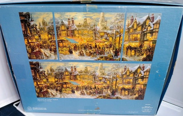 Jigsaw puzzle box with winter village scene on a blue background